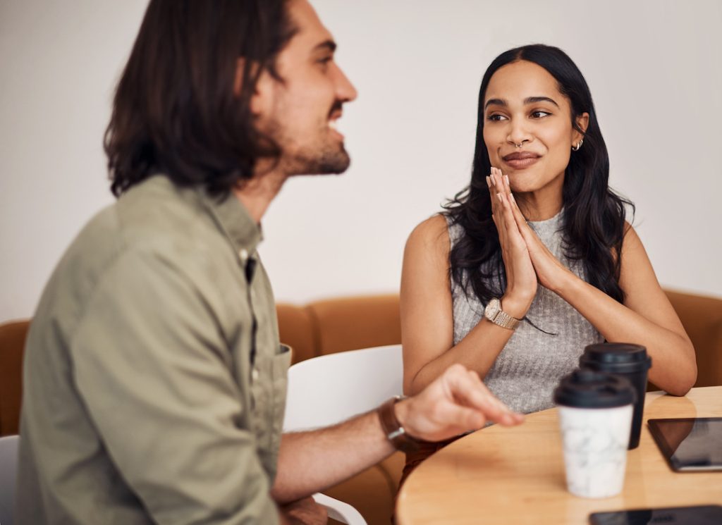 woman hoping to convince a customer to buy her product as a business owner